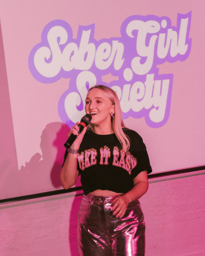 Millie Gooch speaking at a Sober Girl Society event